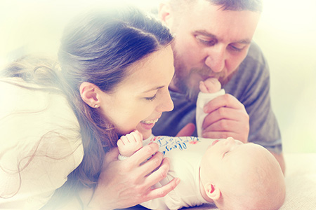 parents and new born son after bris